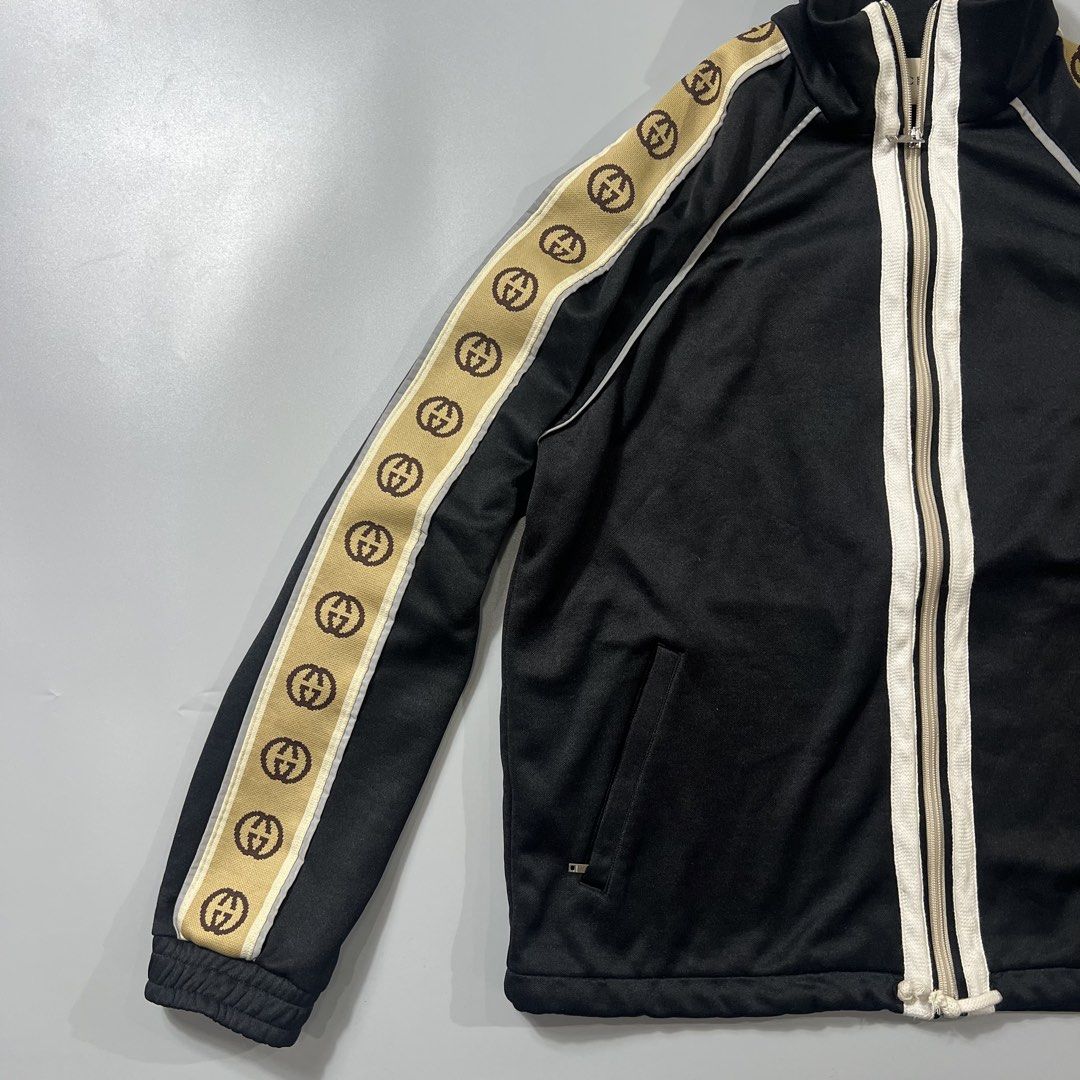 Gucci GG Track Jacket (Category: Coats, Jackets and Outerwear) located in Baguio. Submitted by pinkpixie (Listing ID 1454153876, Image 3). Description: - Iconic GG monogram stripe down the sleeves - Zip-up front with stand-up collar - Two side pockets with zippers - Made in Italy - Ideal for casual wear or athleisure.