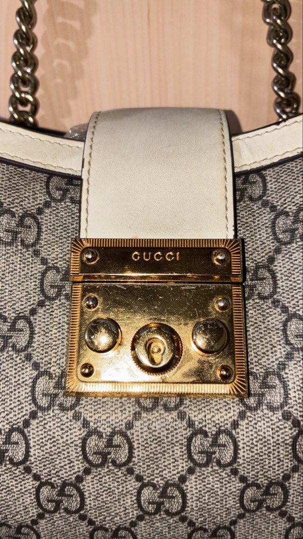Gucci Padlock GG Supreme Canvas Shoulder Bag (Category: Luxury Bags & Wallets) located in Placer. Submitted by talaalond61563 (Listing ID 1454127630, Image 3). Description: - Gucci Padlock Tote Bag - Classic GG Supreme canvas with white leather trim - Gold-tone hardware and chain strap - Secure lock closure with Gucci engraving - Made in Italy - Serial number: 498156 6368.