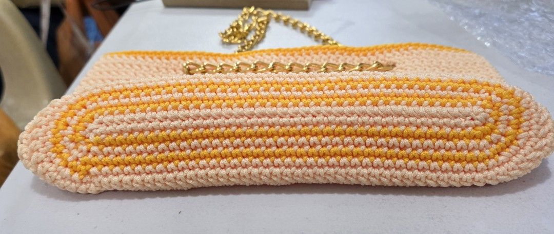 Handmade Crochet Bag with Gold Chain Strap (Category: Purses & Pouches) located in Quezon City. Submitted by celestial_matters (Listing ID 1454104574, Image 3). Description: - Cute handmade crochet bag - Features charming peach and yellow stripes - Comes with a stylish gold chain strap - Versatile for everyday wear or a night out - Unique and eye-catching design - Bottom : 10" long & 2.75" wide - width : 11" - height: 5.5" - chain : 30" long; clo