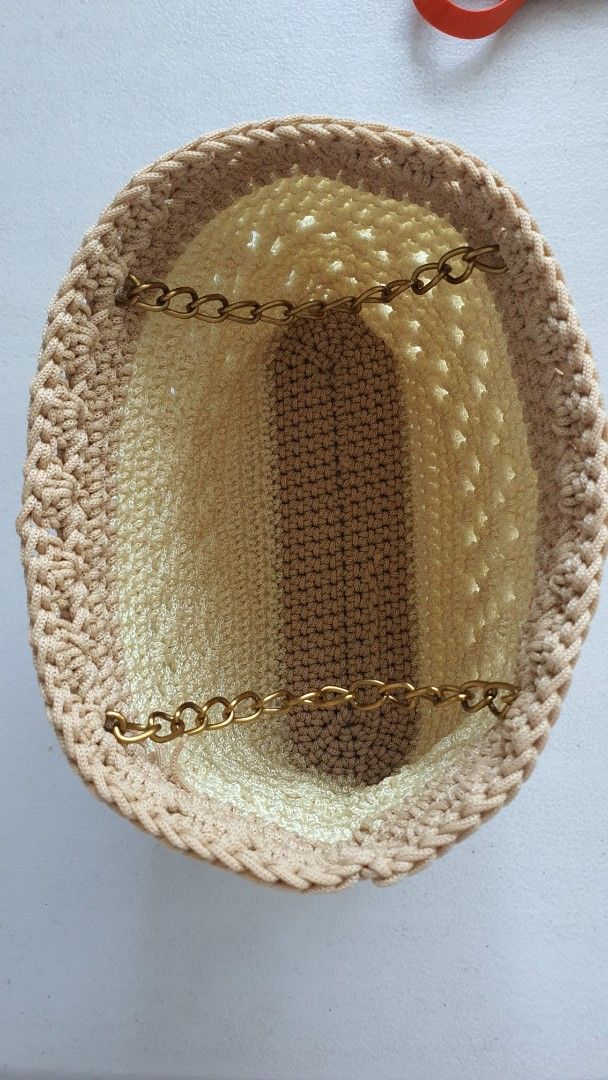 Handmade Crocheted Bag with Chain Strap (Category: Purses & Pouches) located in Quezon City. Submitted by celestial_matters (Listing ID 1454098751, Image 3). Description: - Cute handmade crochet purse or clutch - Beige and brown color combination - Features a stylish gold chain strap - Intricate and unique crochet pattern - Spacious interior for your essentials - Ideal for cocktail events or as a statement accessory - bottom : 6.5" long & 1.75" w