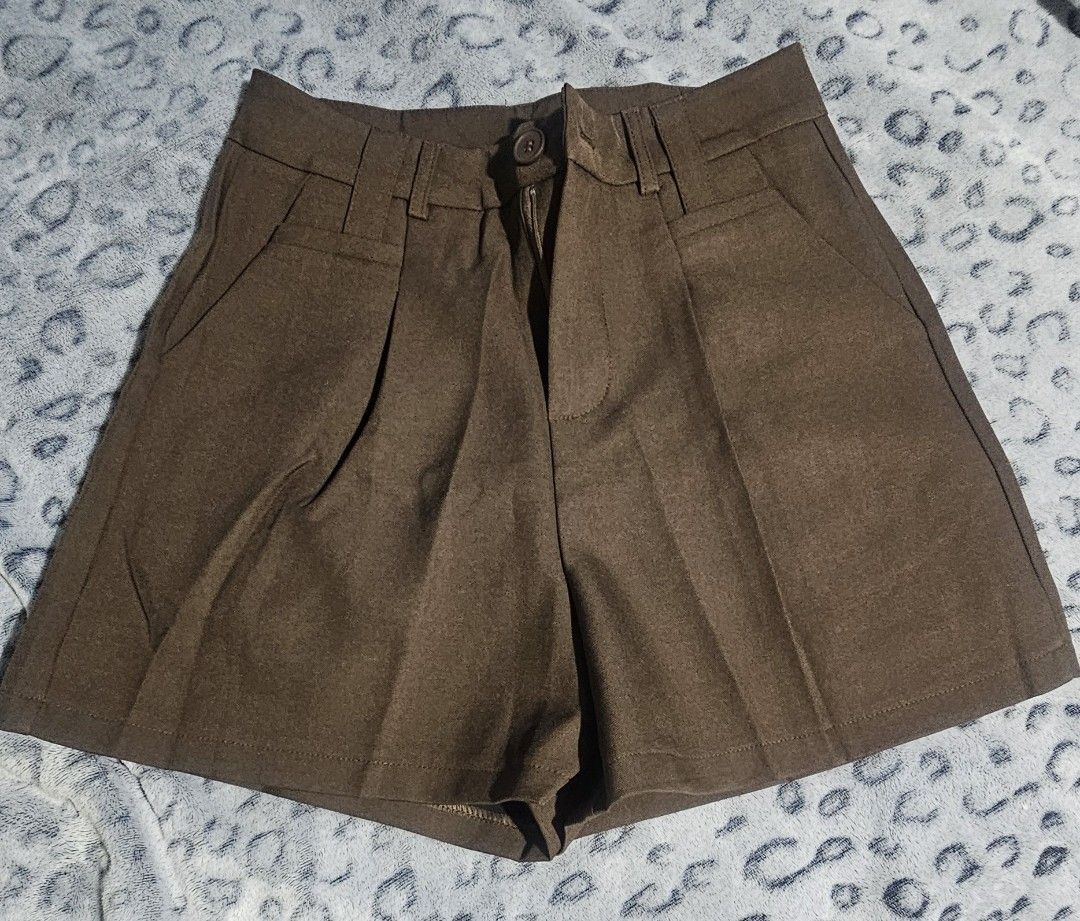 High-waisted Pleated Shorts with Belt Loops (Category: Shorts) located in Baguio. Submitted by msgold2601 (Listing ID 1454005247, Image 2). Description: - High-waisted design - Classic pleated front - Belt loops - Includes matching fabric belt - Relaxed and comfortable fit - Versatile for casual or dressed-up looks - Available colors: Brown, Beige,Choco.