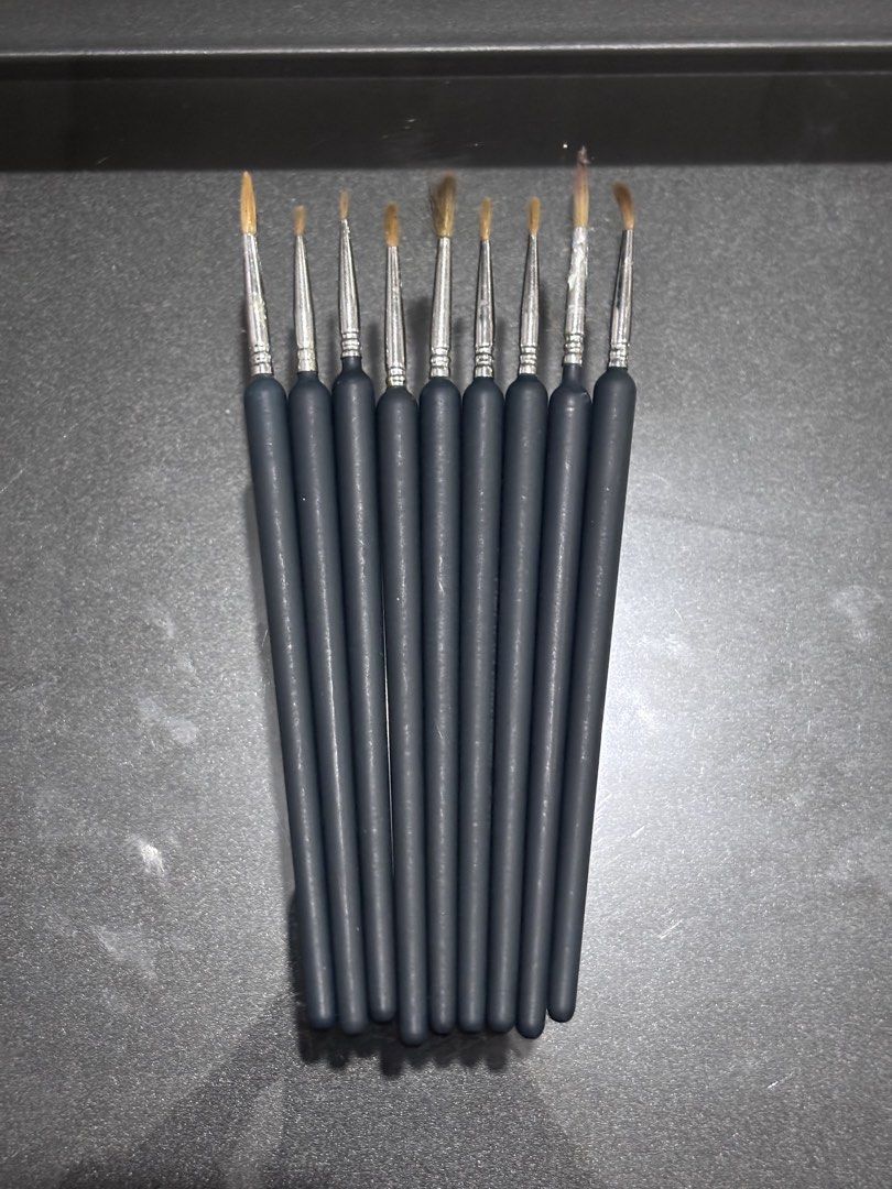 Hokka Paint Brushes (Category: Craft Supplies & Tools) located in Antipolo. Submitted by stephentab38127 (Listing ID 1454126173, Image 1). Description: - Set of 9 paint brushes - Black handles with silver ferrules - Fine brush tips, ideal for detailed work - Suitable for art projects and crafts - Condition varies: some lightly used, others appear new.