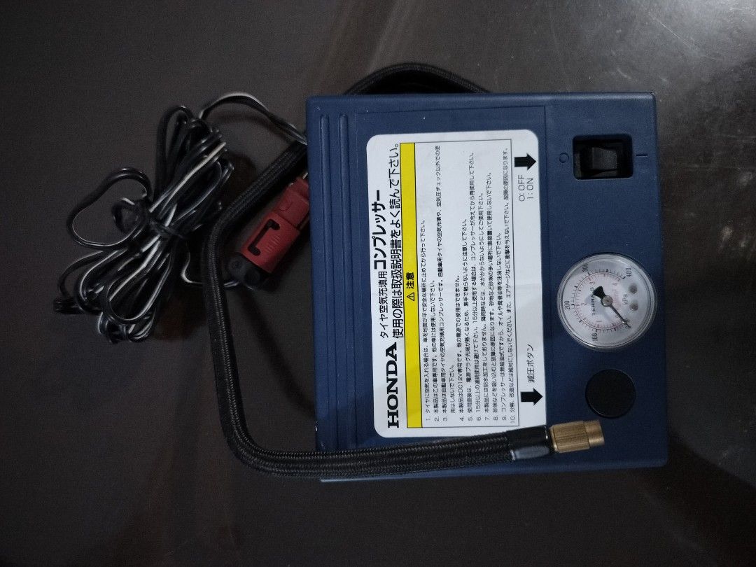 HONDA Tire Air Compressor DC 12V (Category: Other Automotive Parts and Accessories) located in Bulacan. Submitted by kosme2erp (Listing ID 1454087468, Image 1). Description: - Honda DC 12V Tire Air Compressor - Designed for Car Tires - Built-in Pressure Gauge - Deflation Button Included - Essential for Emergencies - Manual Provided for Proper Use.