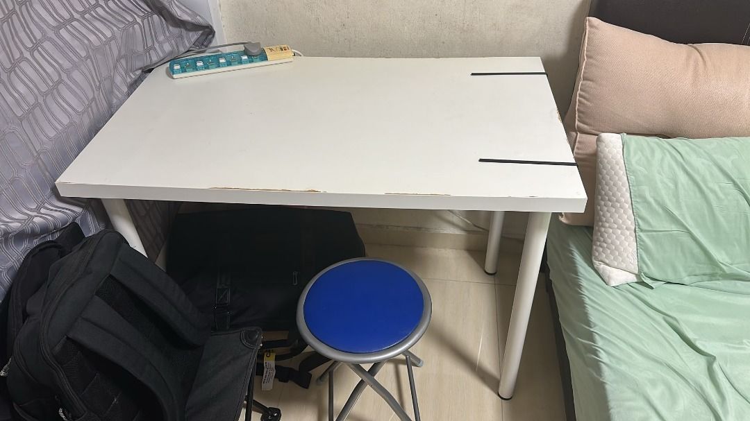 Ikea Study Table (Category: Tables & Sets) located in Singapore. Submitted by evelyn.104 (Listing ID 1454041750, Image 1). Description: - Simple white study desk - Good size for student or home office - Sturdy metal legs - Minor wear on edges (as pictured) - Perfect for drawing, writing, or laptop use - Easy to assemble.