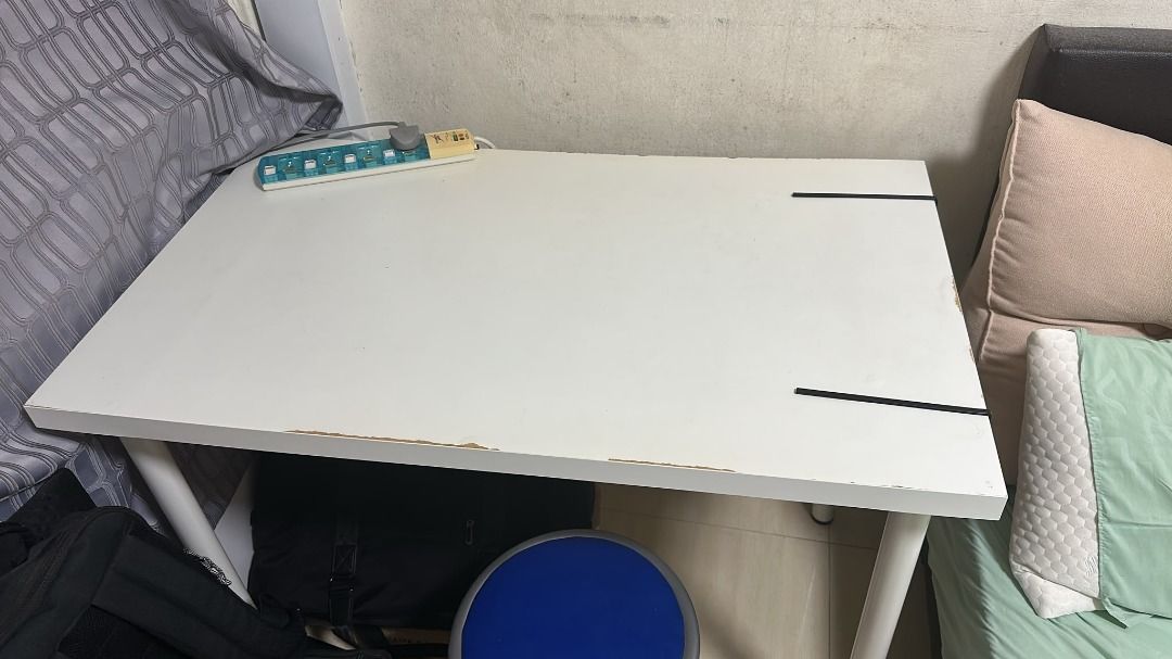 Ikea Study Table (Category: Tables & Sets) located in Singapore. Submitted by evelyn.104 (Listing ID 1454041750, Image 2). Description: - Simple white study desk - Good size for student or home office - Sturdy metal legs - Minor wear on edges (as pictured) - Perfect for drawing, writing, or laptop use - Easy to assemble.