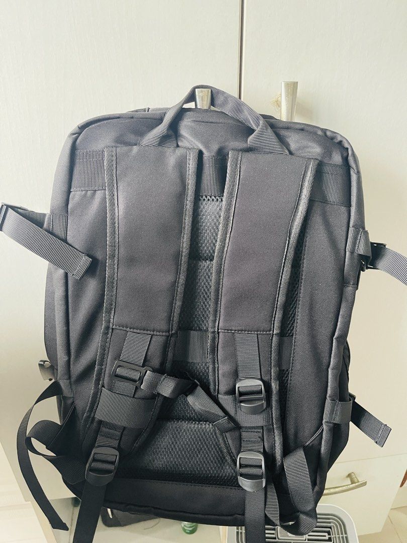 Island Elephant Travel Backpack (Category: Backpacks) located in Manila. Submitted by ttbbkk (Listing ID 1454013514, Image 3). Description: - Island Elephant black backpack - Multiple compartments for organized storage - Includes main bag, phone bag, power bank bag, and pencil case slots - Front zippered pocket and vertical zippered pocket - Luggage strap for attaching to trolley cases - Side tote pocket for quick access items - Comfortable honey