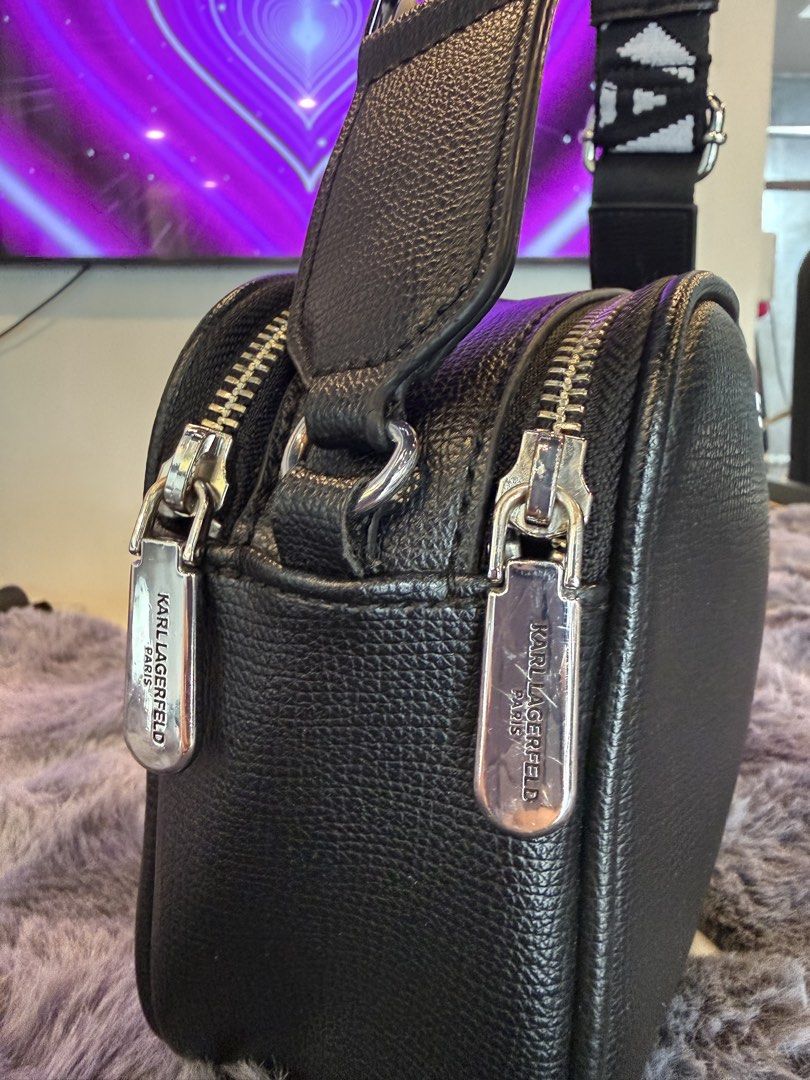 Karl Lagerfeld Paris Maybelle (Category: Cross-body Bags) located in Manila. Submitted by source.selection (Listing ID 1454059562, Image 3). Description: This Karl Lagerfeld Paris Maybelle camera bag is crafted from black textured leather and features a distinctive white logo strap..