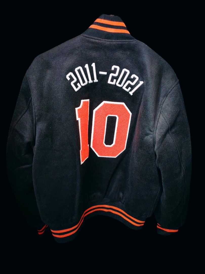 Kith New York Knicks Varsity Jacket "10" 2011-2021 (Category: Coats, Jackets and Outerwear) located in Las Pinas. Submitted by jasongliponeo (Listing ID 1454151986, Image 2). Description: - Kith x New York Knicks Varsity Jacket - Size: L - 'New York' embroidered on the front - '2011-2021 10' detail on the back - Kith logo patch on the left sleeve - Ribbed collar, cuffs, and hem for a comfortable fit - Made in the USA - Brand new with tags - 80k a