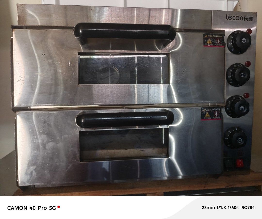 Lecon commercial double-deck electric pizza/deck oven (Category: Ovens & Toasters) located in Bulacan. Submitted by divinadela05430 (Listing ID 1454007483, Image 1). Description: Used (good working condition Double deck with pizza stone Stainless steel body Independent temperature controls for each deck. Perfect for pizza, bread, pastries, and other baked products.