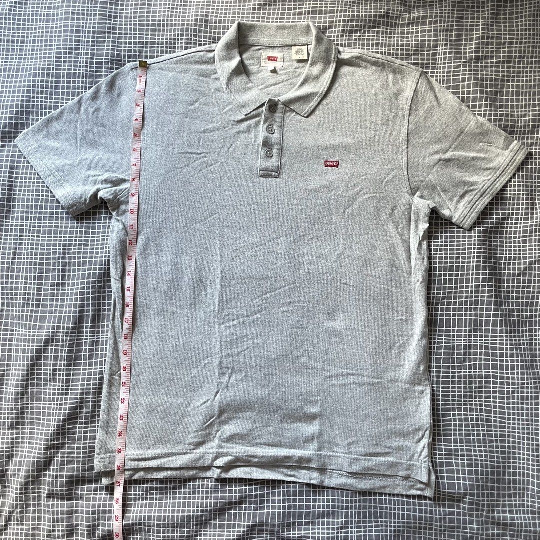 Levi's Grey Polo Shirt Size M (Category: Tshirts & Polo Shirts ) located in Mandaluyong City. Submitted by elmo_7 (Listing ID 1454036551, Image 2). Description: - Grey Levi's Polo Shirt - Classic red tab logo on chest - Made in Pakistan - Size: Medium (M) - Measurements: Pit to pit 20 inches, Length 28 inches - Ideal for casual everyday wear.