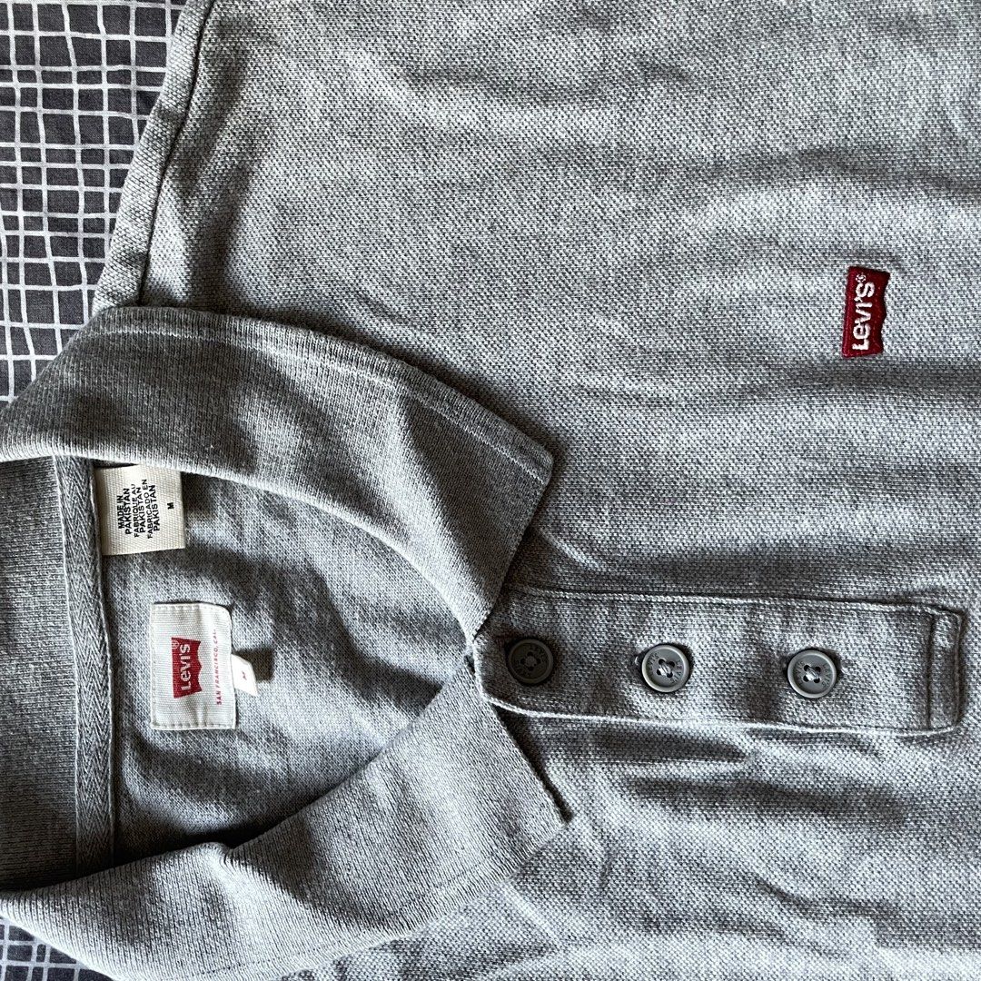 Levi's Grey Polo Shirt Size M (Category: Tshirts & Polo Shirts ) located in Mandaluyong City. Submitted by elmo_7 (Listing ID 1454036551, Image 3). Description: - Grey Levi's Polo Shirt - Classic red tab logo on chest - Made in Pakistan - Size: Medium (M) - Measurements: Pit to pit 20 inches, Length 28 inches - Ideal for casual everyday wear.