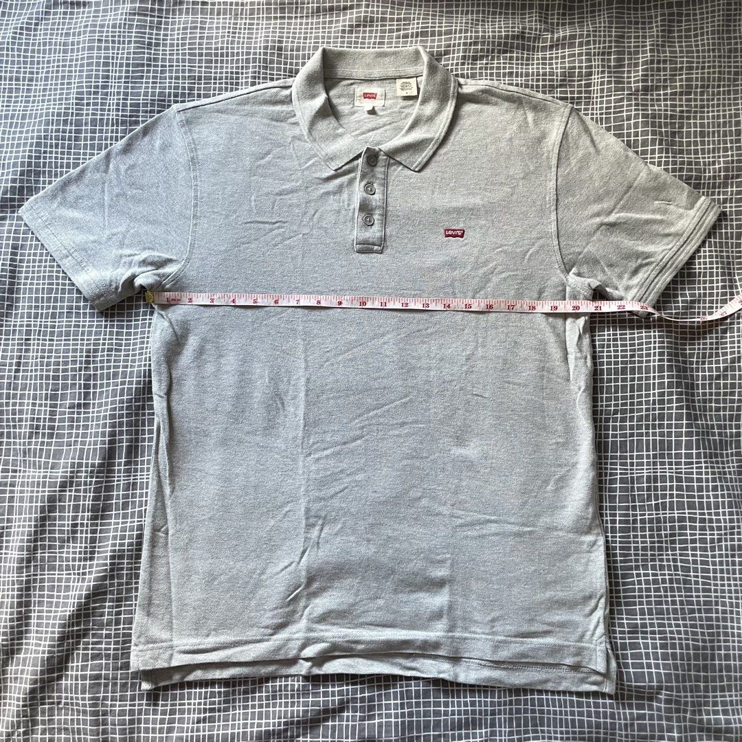 Levi's Grey Polo Shirt Size M (Category: Tshirts & Polo Shirts ) located in Mandaluyong City. Submitted by elmo_7 (Listing ID 1454036551, Image 1). Description: - Grey Levi's Polo Shirt - Classic red tab logo on chest - Made in Pakistan - Size: Medium (M) - Measurements: Pit to pit 20 inches, Length 28 inches - Ideal for casual everyday wear.