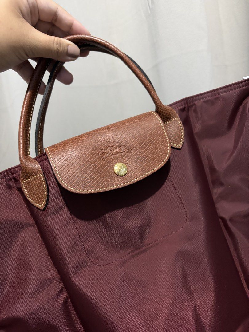 Longchamp Burgundy Top Handle Document/ Laptop Bag (Category: Luxury Bags & Wallets) located in Pasay City. Submitted by theluxefinds.phonhand (Listing ID 1454135972, Image 2). Description: Rare color and size( can attach sling but not included) Original new longchamp.