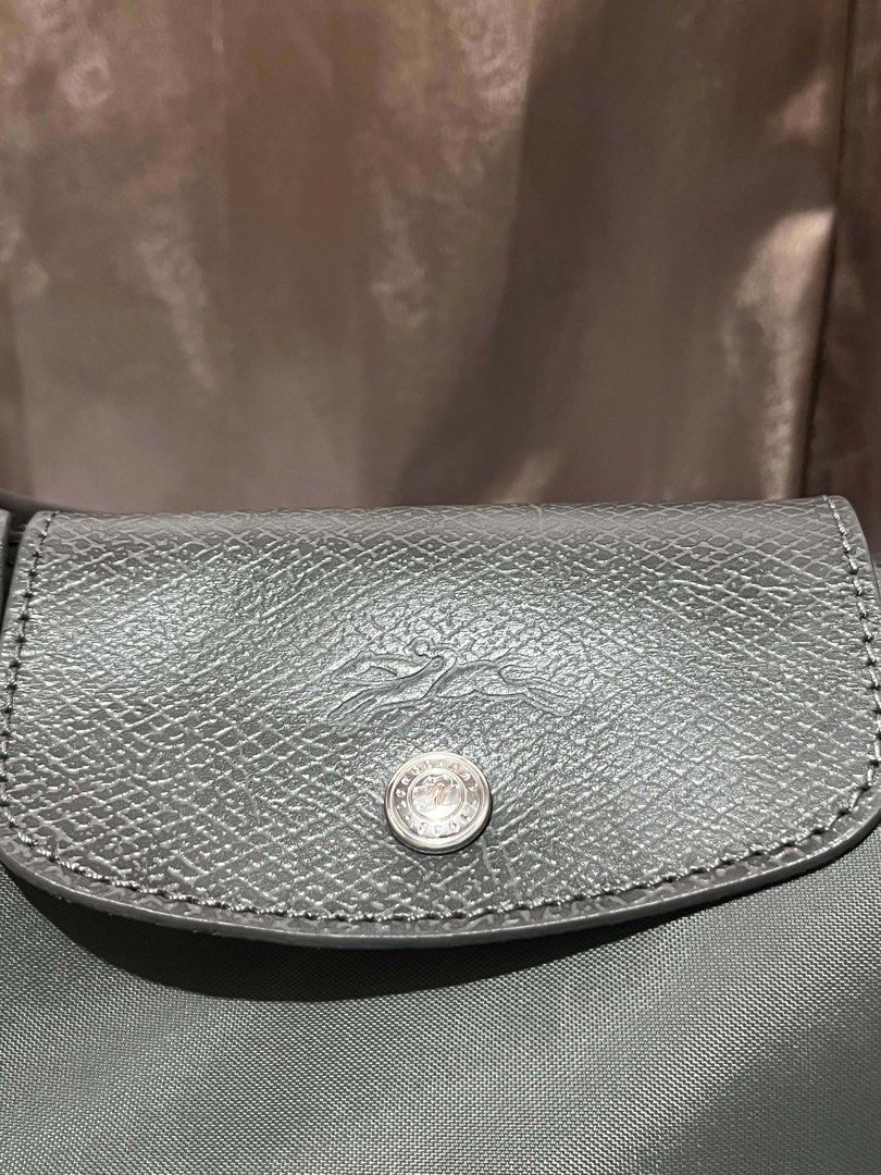 AUTHENTIC Longchamp Le Pliage Tote Bag MLH GRAPHITE (Category: Luxury Bags & Wallets) located in Cebu City. Submitted by _preloved09 (Listing ID 1454115951, Image 3). Description: AUTHENTIC LONGCHAMP Bought via pasabuy, shopewithmitchhh on IG, message me for the proof of transaction. Color: Graphite Please see the pictures for the issues. The hardware became tarnished after I sprayed alcohol on it. Helping tags: Coach, Lacoste, Longchamp, Tory Bu