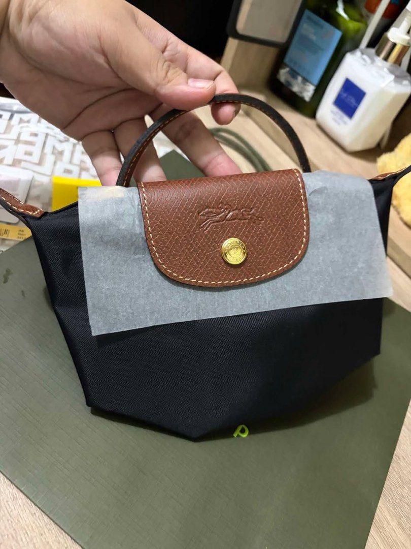 Longchamp Mini Pouch (Category: Luxury Bags & Wallets) located in Pasay City. Submitted by theluxefinds.phonhand (Listing ID 1454136219, Image 2). Description: Original Brandnew xs pouch With paperbag and proof of purchase Ready to ship .