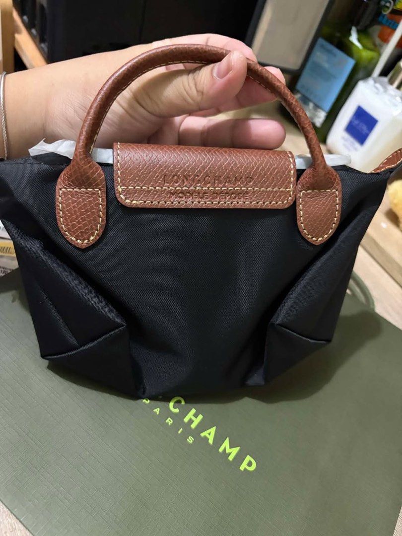 Longchamp Mini Pouch (Category: Luxury Bags & Wallets) located in Pasay City. Submitted by theluxefinds.phonhand (Listing ID 1454136219, Image 3). Description: Original Brandnew xs pouch With paperbag and proof of purchase Ready to ship .