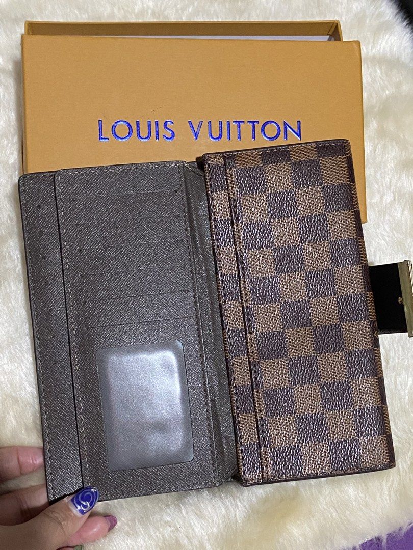 Louis Vuitton Damier Ebene Canvas Long Wallet (Category: Luxury Bags & Wallets) located in Manila. Submitted by yamskei04 (Listing ID 1454037025, Image 3). Description: - Authentic Louis Vuitton wallet - Damier Ebene canvas - Multiple card slots and compartments - Includes original Louis Vuitton box - Perfect for organizing your essentials.