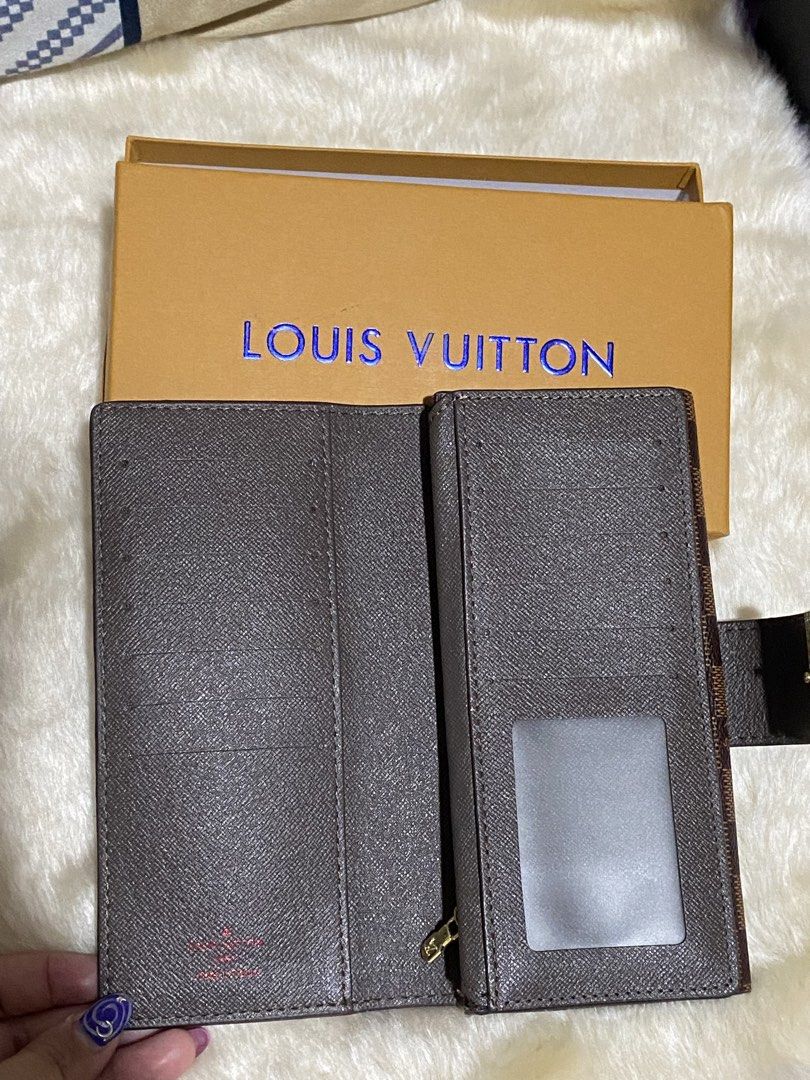 Louis Vuitton Damier Ebene Canvas Long Wallet (Category: Luxury Bags & Wallets) located in Manila. Submitted by yamskei04 (Listing ID 1454037025, Image 2). Description: - Authentic Louis Vuitton wallet - Damier Ebene canvas - Multiple card slots and compartments - Includes original Louis Vuitton box - Perfect for organizing your essentials.