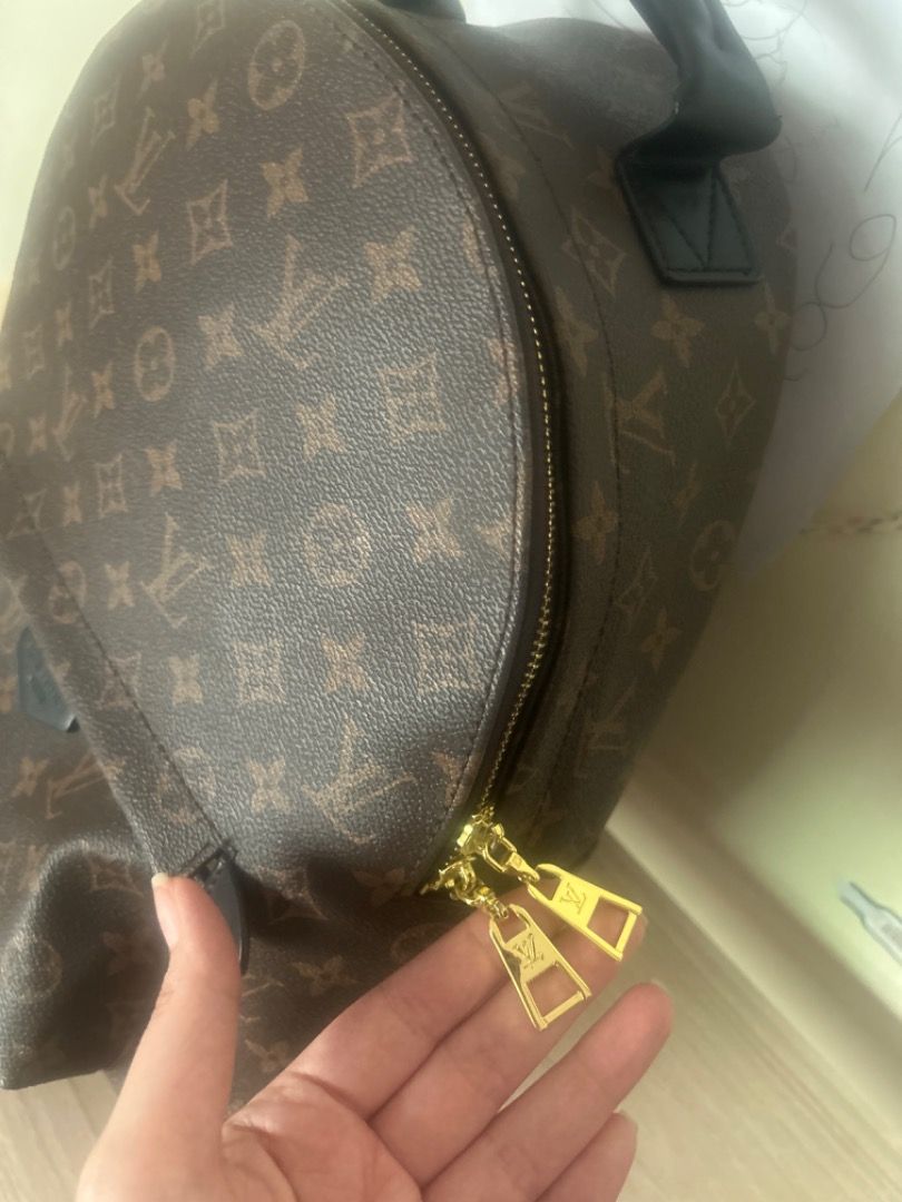 Louis Vuitton Monogram Backpack (Category: Luxury Bags & Wallets) located in Cebu City. Submitted by serene_simplicity (Listing ID 1454050462, Image 3). Description: - Classic Louis Vuitton monogram backpack - Color: Brown canvas with black leather trim - Gold zipper detail on front pocket - Top handle and adjustable shoulder straps - Ideal for everyday use or travel.