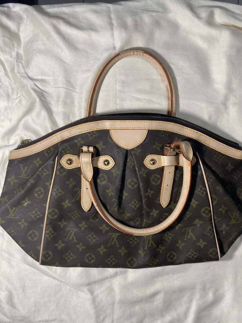 Louis Vuitton Monogram Canvas Tote Bag (Category: Luxury Bags & Wallets) located in Manila. Submitted by vasttree.6bc15f (Listing ID 1454113006, Image 1). Description: - Vuitton Monogram Tote Bag - Classic monogram canvas with leather trim and handles - Secure zipper closure with a small LV charm - Interior pockets for easy organization - Perfect for everyday use - Noteworthy: Shows some signs of wear on handles and leather trim.