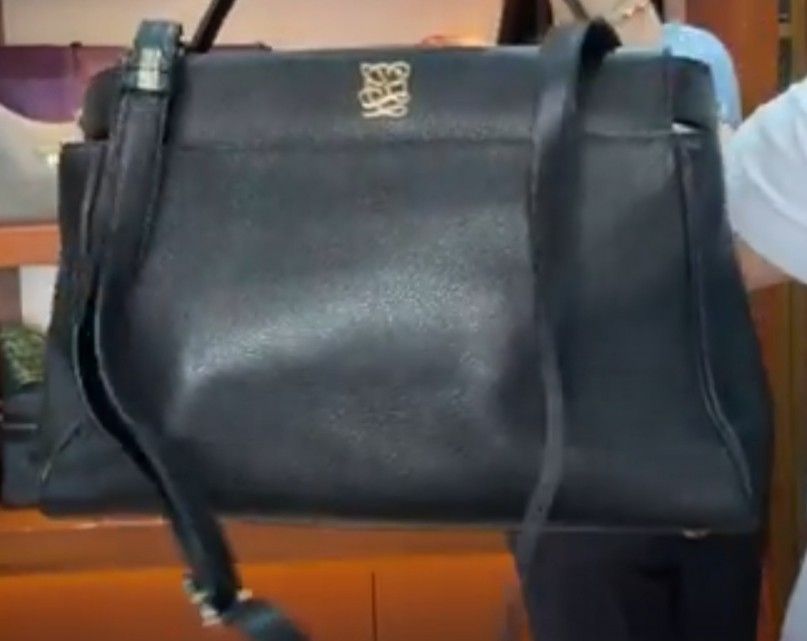 Louise Quatorze Black Leather Handbag (Category: Luxury Bags & Wallets) located in Manila. Submitted by liveeagle-c6d8 (Listing ID 1454135098, Image 2). Description: - Genuine black leather handbag - Features the iconic louise quatorze anagram logo in elegant gold hardware - Comes with a detachable shoulder strap for versatile carrying options - Structured silhouette for a polished look - Spacious interior, ideal for everyday essentials - Perfect