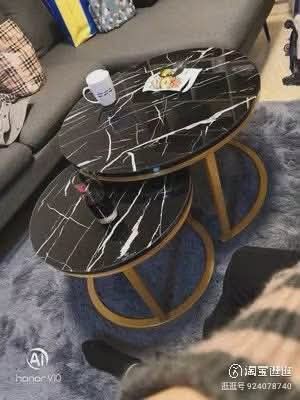 Marble Effect Nesting Coffee Tables - Set of 2 (Category: Tables & Sets) located in Mandaluyong City. Submitted by carmy.94 (Listing ID 1454143619, Image 2). Description: - Set of 2 nesting coffee tables - Marble effect finish on table tops - Large table: Black metal frame - Small table: Gold metal frame - Space-saving design: tuck under each other when not in use - Perfect for living rooms or small apartments.
