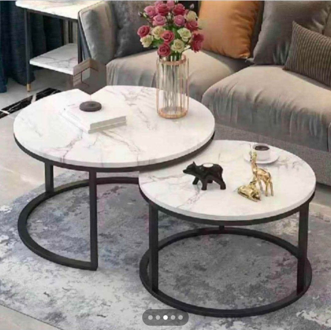 Marble Effect Nesting Coffee Tables - Set of 2 (Category: Tables & Sets) located in Mandaluyong City. Submitted by carmy.94 (Listing ID 1454143619, Image 1). Description: - Set of 2 nesting coffee tables - Marble effect finish on table tops - Large table: Black metal frame - Small table: Gold metal frame - Space-saving design: tuck under each other when not in use - Perfect for living rooms or small apartments.