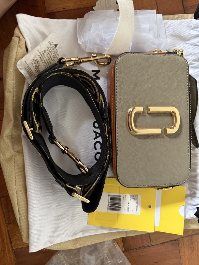 Marc Jacobs Snapshot Camera Bag (Category: Luxury Bags & Wallets) located in Quezon City. Submitted by msaisa (Listing ID 1454061156, Image 1). Description: - Authentic Marc Jacobs camera bag - Adjustable crossbody strap for comfortable wear - Elegant gold hardware details - Includes original dust bag and tags - Ideal for everyday essentials and style.