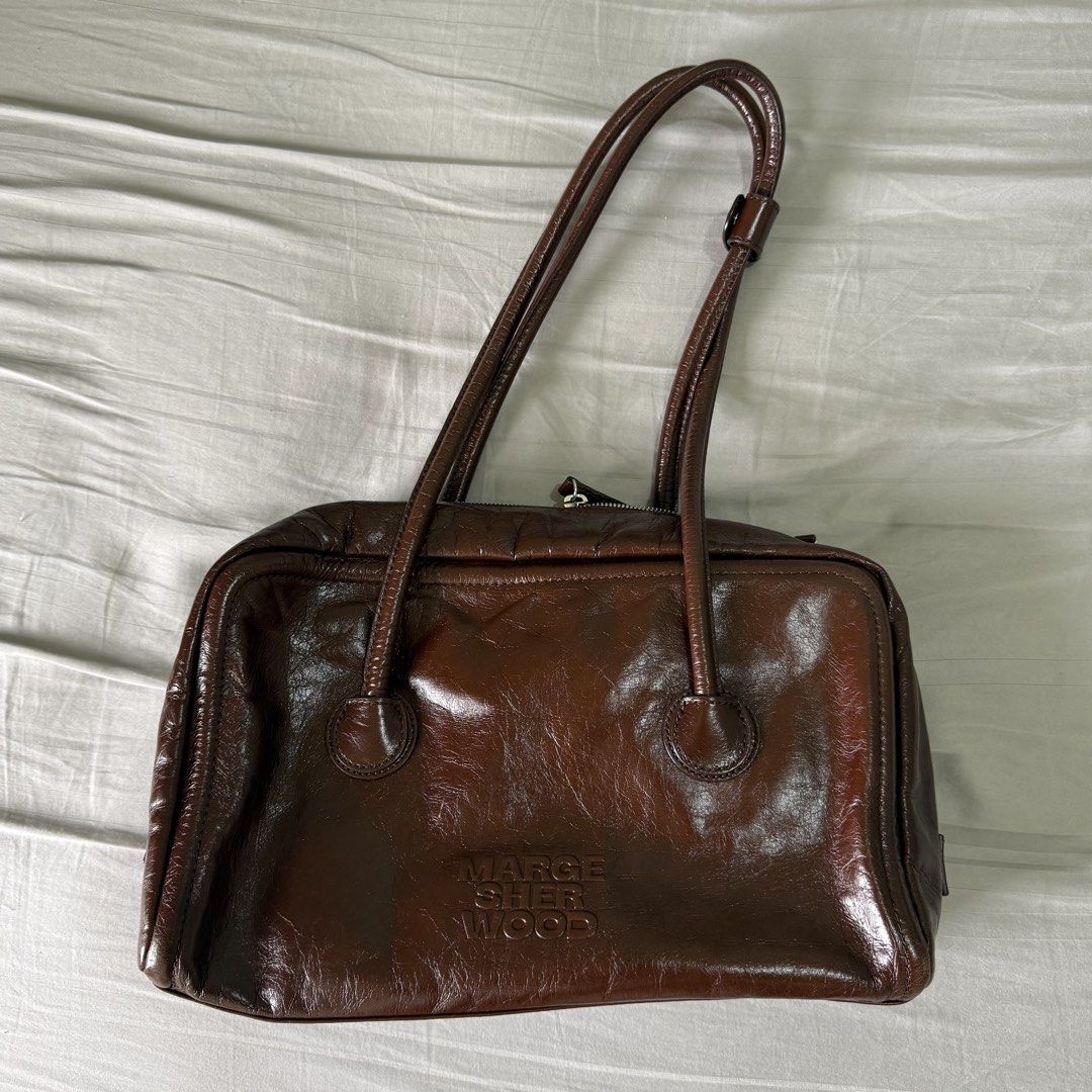 Marge Sherwood Soft Boston Bag (Category: Shoulder Bags) located in Pasig City. Submitted by djddmd (Listing ID 1454034245, Image 1). Description: 🤍 Mocha Crinkle - bought for 17k from korean shop on 🍊 app Rfs: decluttering Loc: kapitolyo Mop: bpi/gcash Mod: grab/lalamove (shouldered by buyer).