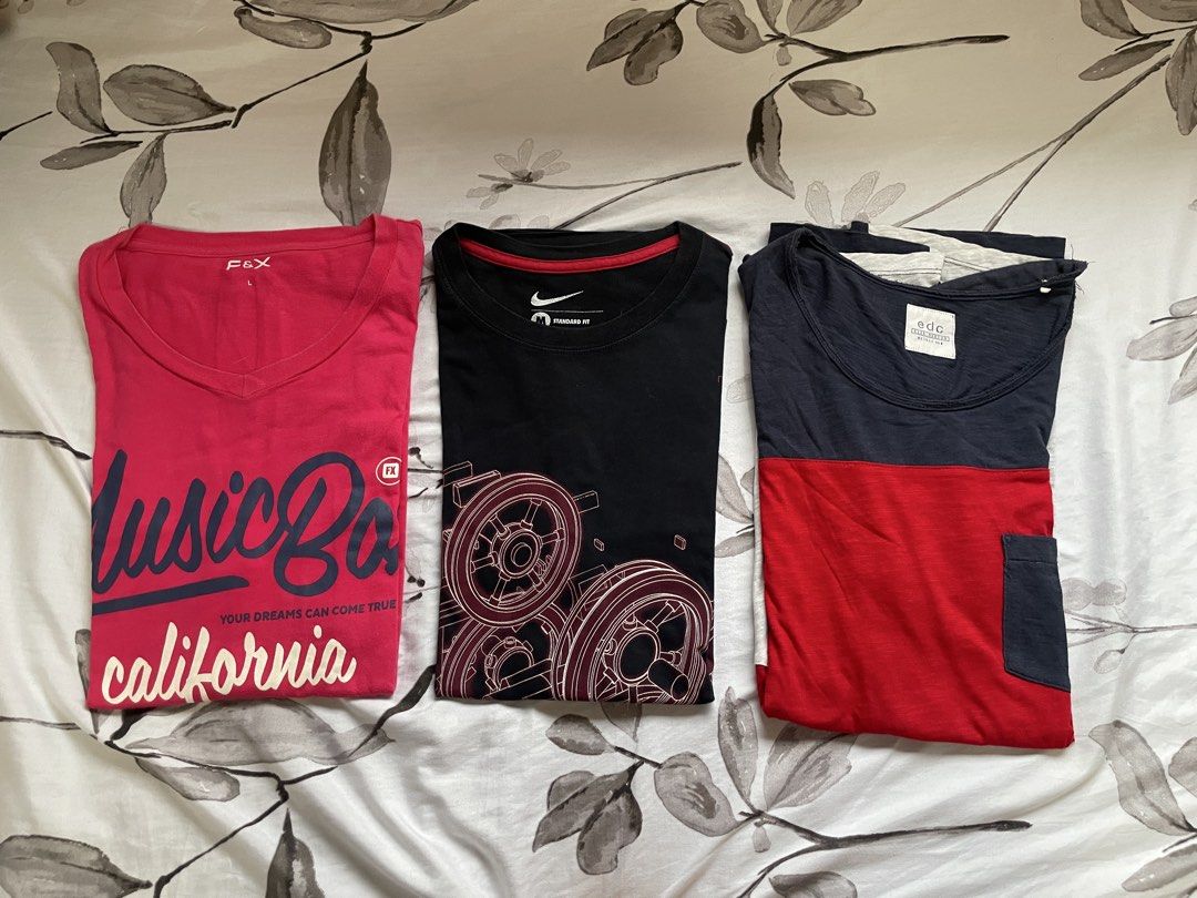 men tshirts (Category: Tshirts & Polo Shirts ) located in Antipolo. Submitted by eferdzx (Listing ID 1454117179, Image 1). Description: - Bundle of 3 men casual t-shirts - Includes: Pink F&X 'Music Bay California' tee. (SIZE L) - Includes: Black Nike tee with gear graphic. (SIZE M) - Includes: Navy and red EDC colorblock tee. (SIZE M) * open for tingi 📍lower antipolo city 🚚 jnt/ggx/lalamove 💳 maribank/gcash .