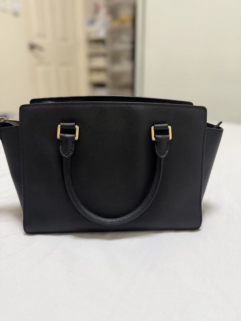 Michael Kors Black Leather Satchel Handbag (Category: Luxury Bags & Wallets) located in Makati City. Submitted by shimini (Listing ID 1454103608, Image 2). Description: - Genuine black leather Michael Kors satchel - Authentic - Bought in Japan - No issues Taguig/Makati.