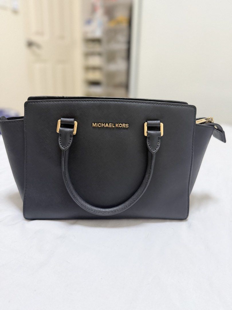 Michael Kors Black Leather Satchel Handbag (Category: Luxury Bags & Wallets) located in Makati City. Submitted by shimini (Listing ID 1454103608, Image 1). Description: - Genuine black leather Michael Kors satchel - Authentic - Bought in Japan - No issues Taguig/Makati.