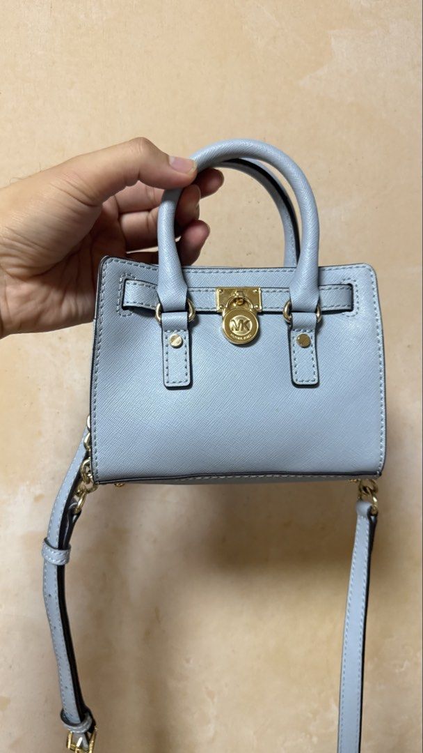 Michael Kors Micro Hamilton Handbag Crossbody Bag (Category: Luxury Bags & Wallets) located in Calamba. Submitted by ashvault (Listing ID 1454034711, Image 2). Description: Michael Kors Micro Hamilton Handbag Crossbody Bag in light blue.