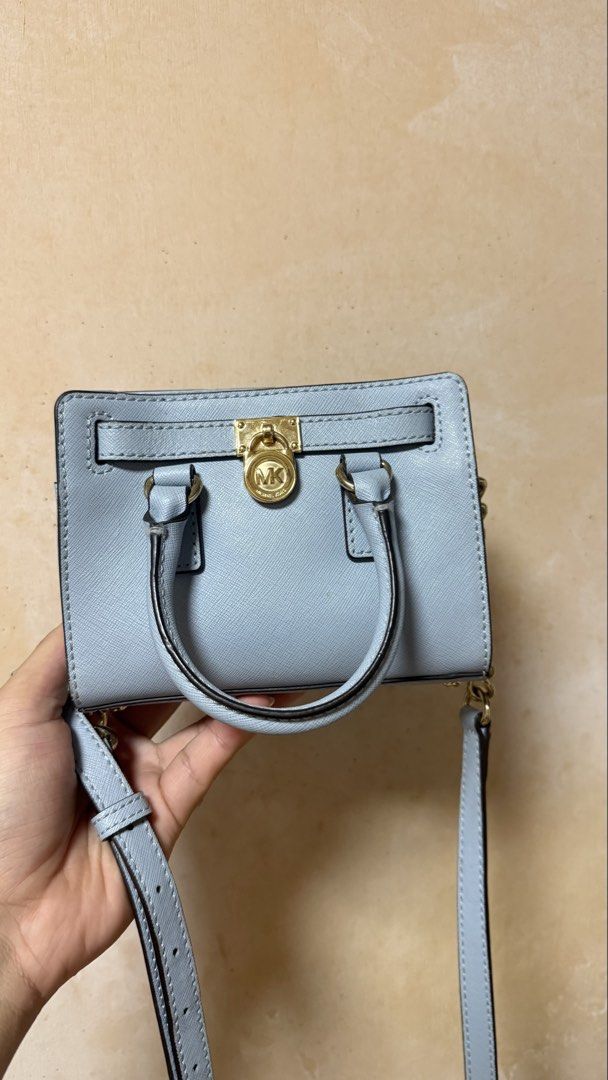 Michael Kors Micro Hamilton Handbag Crossbody Bag (Category: Luxury Bags & Wallets) located in Calamba. Submitted by ashvault (Listing ID 1454034711, Image 1). Description: Michael Kors Micro Hamilton Handbag Crossbody Bag in light blue.