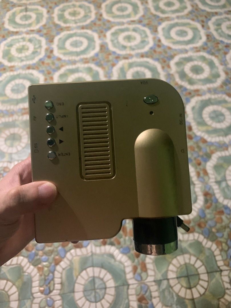 Mini Portable LCD Projector (Category: Projectors) located in Quezon City. Submitted by carlos132 (Listing ID 1454095292, Image 3). Description: - Compact mini projector - Includes power adapter - Ideal for small movie nights or presentations - Simple setup and operation - Portable design.