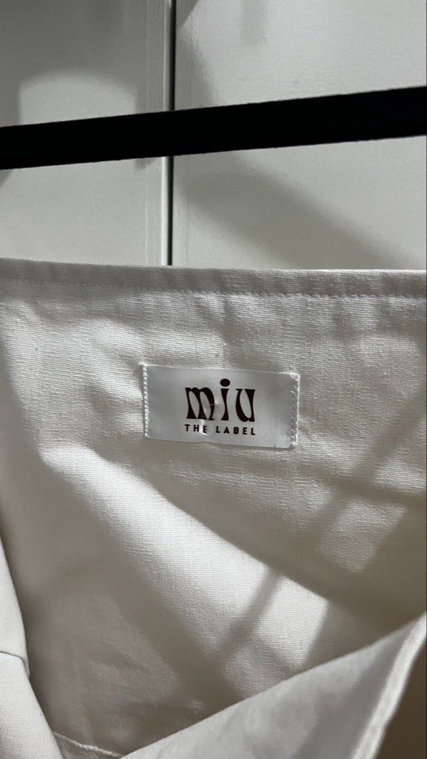 Miuthelabel - Amalfi Top in White (Category: Sleeveless) located in San Fernando. Submitted by khyyyy_ (Listing ID 1454157173, Image 3). Description: - Amalfi top in White but a bit off white on actual - Used once only - RFS: Decluttering *Photo credits from Miuthelabel on ig.