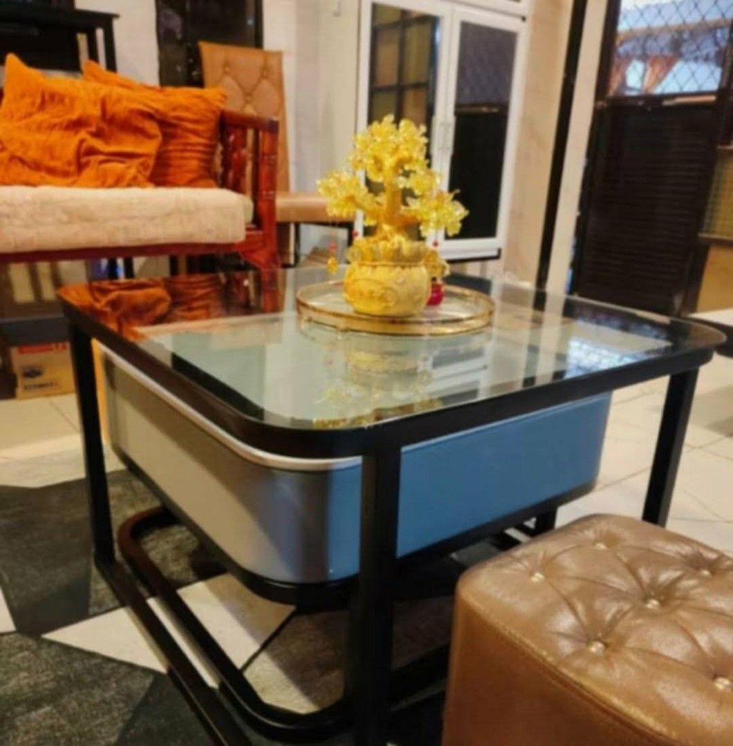 Modern Nesting Coffee Table Set with Drawer (Category: Tables & Sets) located in Mandaluyong City. Submitted by carmy.94 (Listing ID 1454005833, Image 2). Description: Two-piece nesting coffee table set. One table has a marble-look top with a drawer. The other has a dark glass top. Black metal frame. Dimensions are shown in the first photo. Great for living rooms. Easy to arrange..