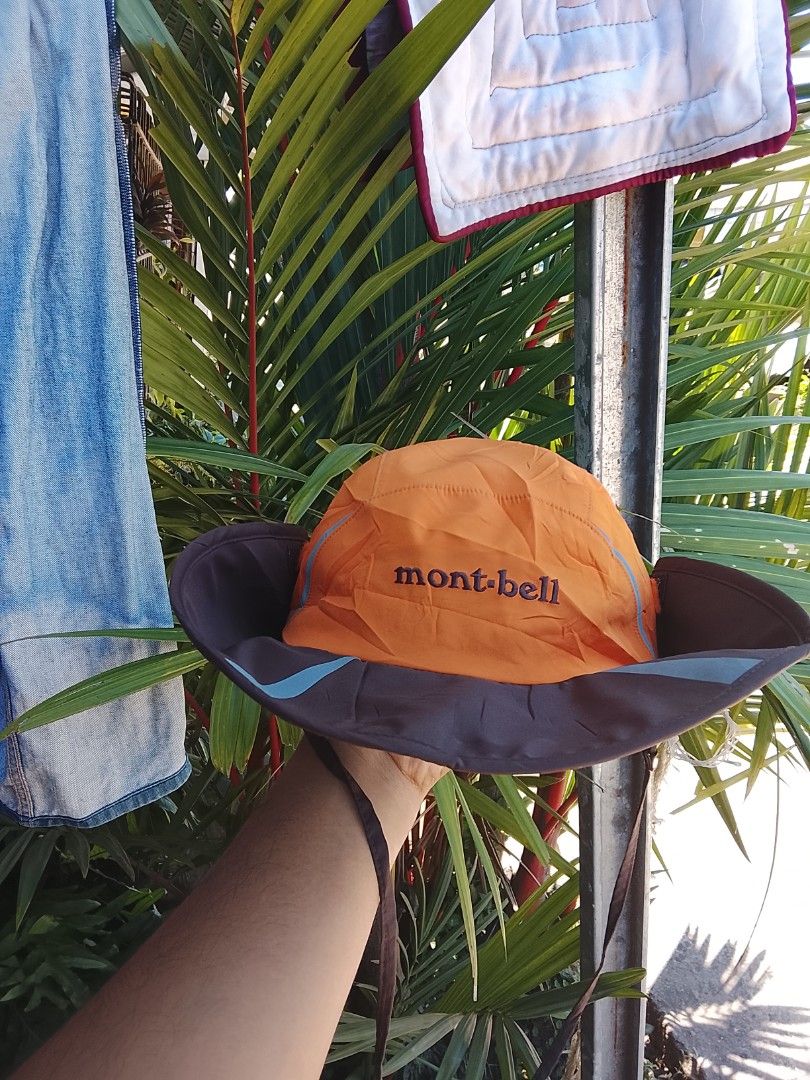 Mont-bell Bucket Hat (Category: Caps & Hats) located in Salay. Submitted by kenzmisael55555 (Listing ID 1454116883, Image 1). Description: - Mont-bell bucket hat - Color: Orange top with brown brim - Adjustable chin strap for a secure fit - Ideal for outdoor activities - Reflective details on top for visibility - Provides excellent sun protection.