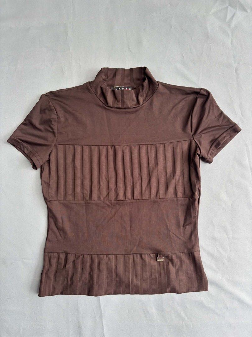 Morgan De Toi Brown Ribbed Mock Neck Top (Category: Luxury Apparel) located in Dasmarinas. Submitted by heyitsmeern (Listing ID 1454067994, Image 1). Description: - Authentic - Morgan De Toi brown short-sleeved top - Mock neck with vertical ribbed detailing - Made in France from Meryl and Spandex blend - Comfortable and stretchy fabric - Perfect for layering or wearing solo Size: One size Stretchy material.