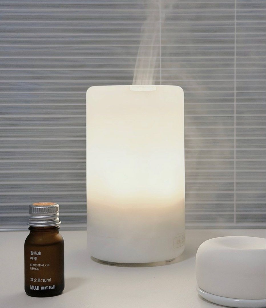 MUJI Ultrasonic Aroma Diffuser with Essential Oil (Category: Home Fragrance) located in Taguig. Submitted by joanna328 (Listing ID 1454082487, Image 1). Description: Bought in greenbelt MUJI store. * Fully functional, light, timer and mist functions all work perfectly * Clean and well maintained * No leaks or cracks * Includes power adapter, original measuring cup * Includes MUJI Sleeping Blend essential oil (around 60–70% remaining) * No box, wi