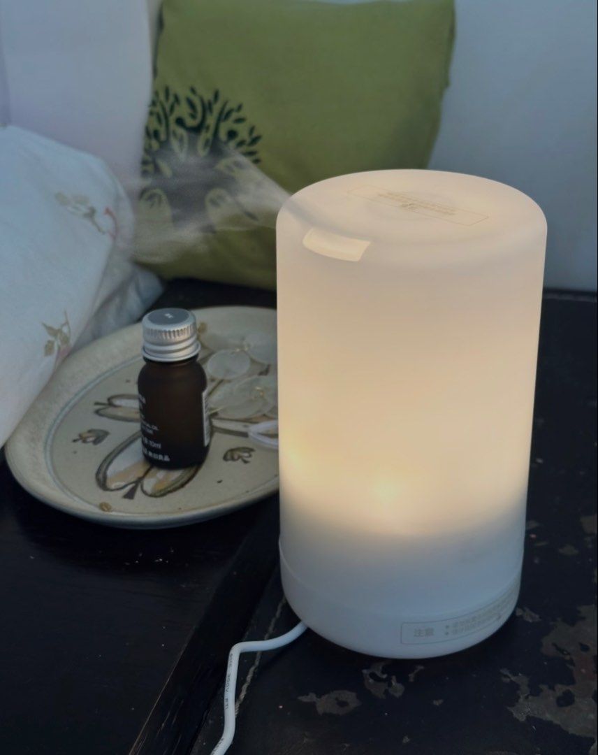 MUJI Ultrasonic Aroma Diffuser with Essential Oil (Category: Home Fragrance) located in Taguig. Submitted by joanna328 (Listing ID 1454082487, Image 2). Description: Bought in greenbelt MUJI store. * Fully functional, light, timer and mist functions all work perfectly * Clean and well maintained * No leaks or cracks * Includes power adapter, original measuring cup * Includes MUJI Sleeping Blend essential oil (around 60–70% remaining) * No box, wi