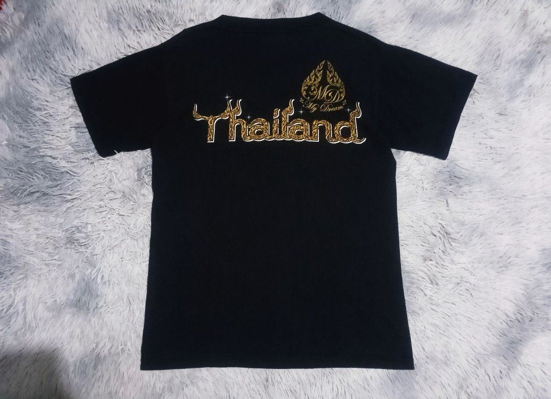 MY DREAM THAILAND TIGER FACE BLACK TEE (Category: Tshirts & Polo Shirts ) located in Davao. Submitted by nevar07 (Listing ID 1454107764, Image 2). Description: SIZE: MEDIUM DIMENSION: W18.5 X L26 DESIGN : Embossed or raised tiger graphic with detailed Thai-style ornamental patterns FABRIC: COTTON COLOR RATE: 9.5/10 READY TO WEAR NO ISSUE DM TO PURCHASE 📥 𝐑𝐄𝐌𝐈𝐍𝐃𝐄𝐑: •𝐂𝐨𝐥𝐨𝐫 𝐦𝐚𝐲 𝐯𝐚𝐫𝐲 𝐝𝐮𝐞 𝐨𝐟 𝐭𝐡𝐞 𝐥𝐢𝐠𝐡𝐭𝐢𝐧𝐢𝐧𝐠 •𝐀𝐥�