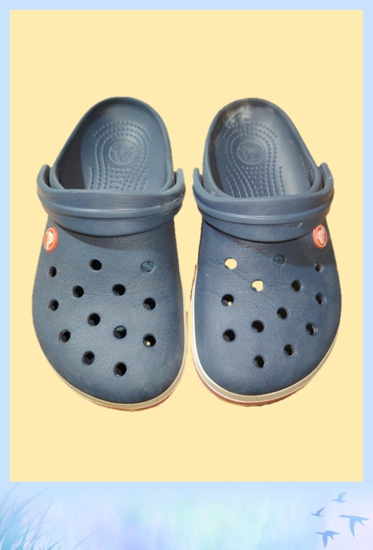 Navy Blue Crocs Clogs Size M4 W6 (Category: Slippers and slides) located in Agdangan. Submitted by kys777 (Listing ID 1454055713, Image 1). Description: - Classic navy blue Crocs clogs - Size: M4 (Men's 4) / W6 (Women's 6) - Iconic comfort and versatile style - Perfect for casual outings, gardening, or lounging - Easy to clean and built to last - Minor signs of wear on the inside.