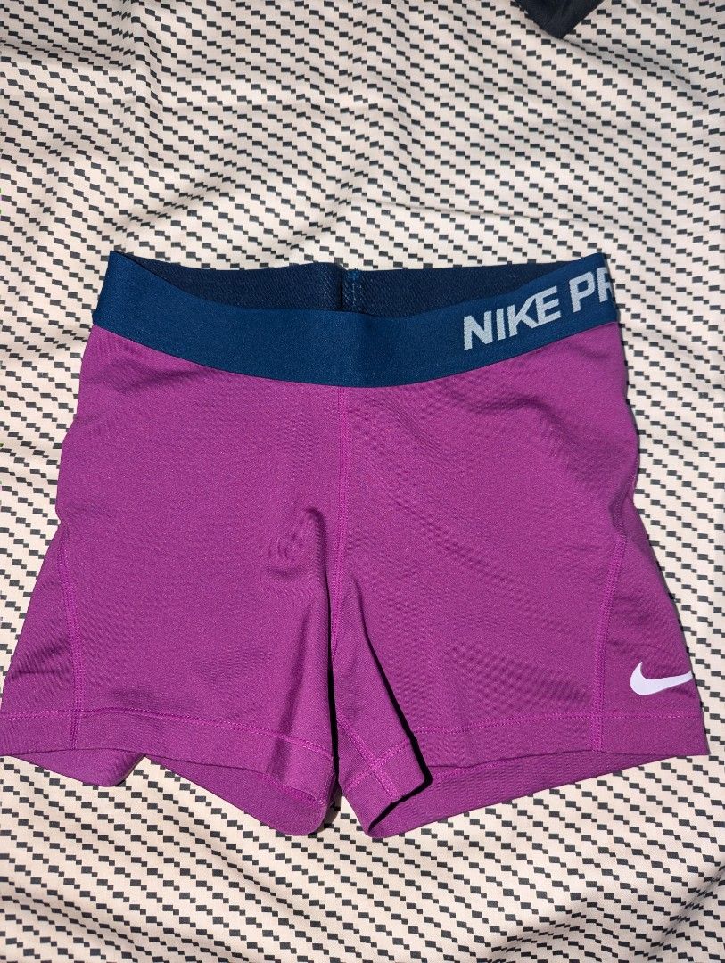 Nike Pro Purple Compression Shorts (Category: Activewear) located in Manila. Submitted by booksandbeyond (Listing ID 1454020195, Image 1). Description: - Purple Nike Pro compression shorts - Elastic waistband with Nike Pro branding - Small Nike swoosh logo on the side - Ideal for workouts and sports - Provides a comfortable and supportive fit.