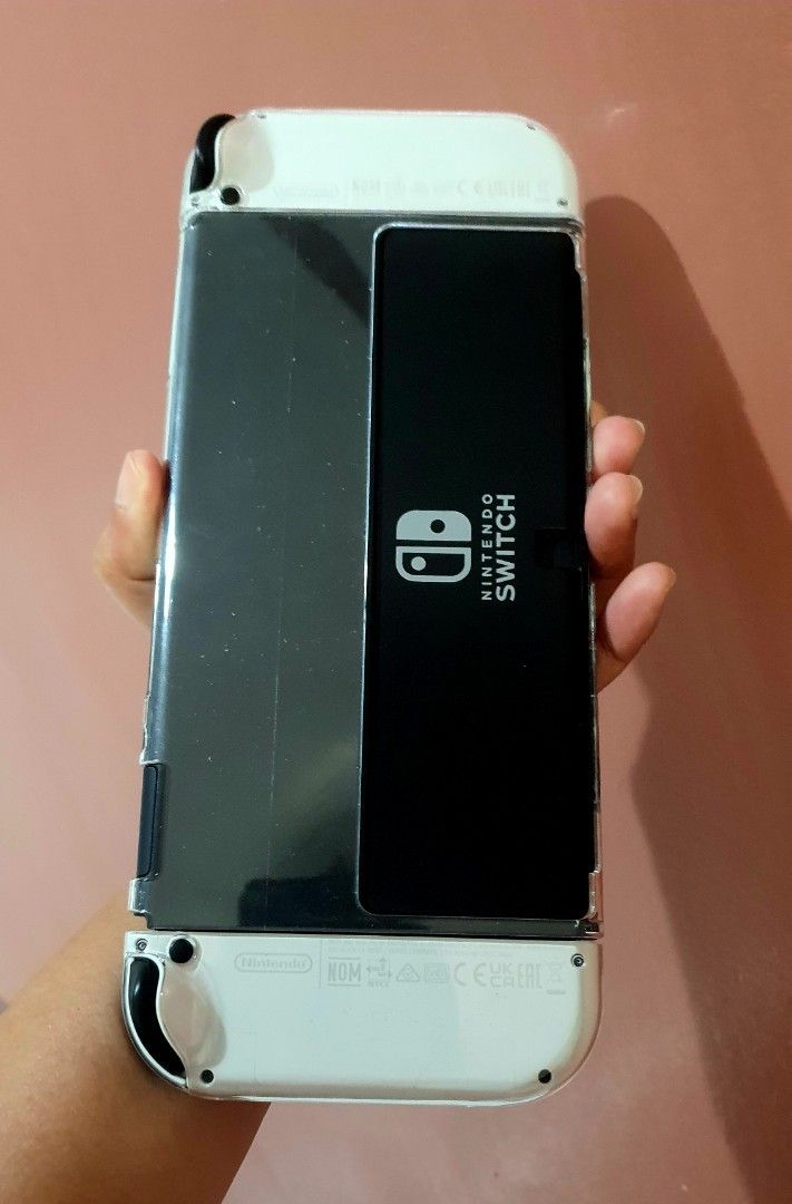 Nintendo Switch OLED White Console with Accessories (Category: Nintendo) located in Las Pinas. Submitted by elyladdaran09 (Listing ID 1454109559, Image 3). Description: PRICE: 9,799 Nintendo Switch OLED Model (White) Naka tempered since day 1 64gb internat memory Includes original dock Comes with Joy-Cons Protective Hard Case & Nintendo Pouch All original cables included complete package and accessories. NO BOX natapon na. Has minimal sign of usa