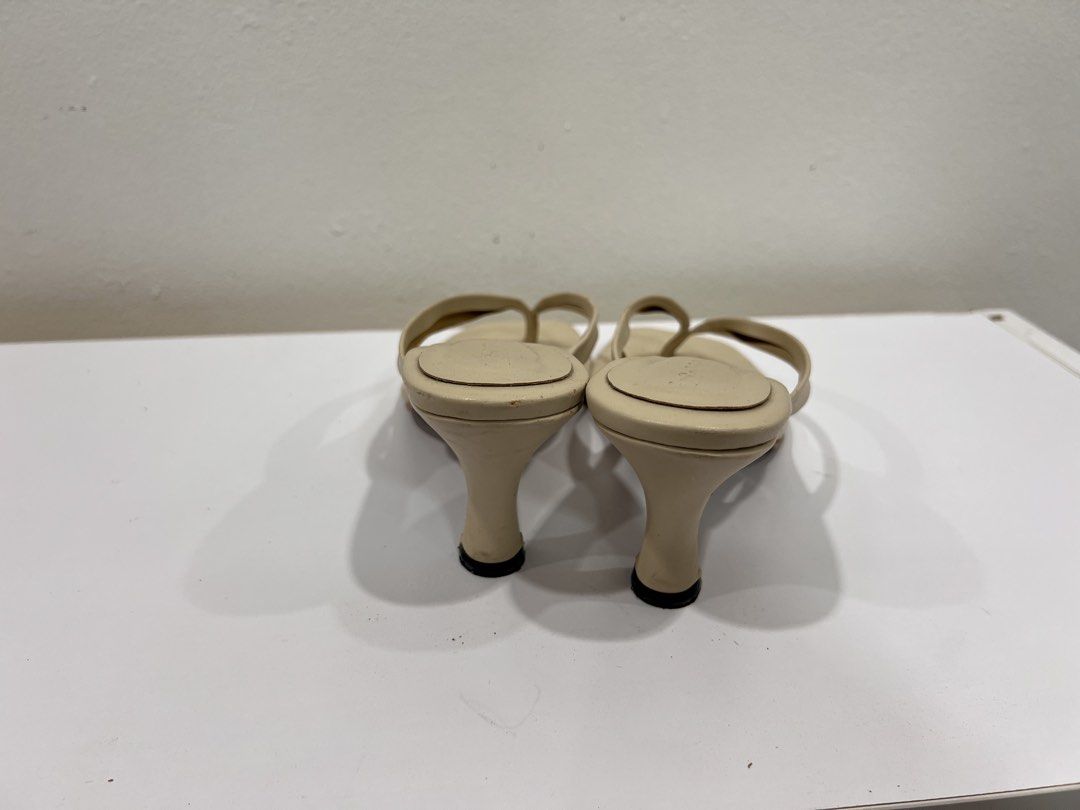 Nude kitten heels (Category: Heels) located in Manila. Submitted by threadtressure (Listing ID 1454102460, Image 3). Description: La Soledad studios barcelona kitten heel sandals beige. Size 8 (US). Peeling of leather on the strap part Condition: 5/10 Issues: Peeling on some areas.