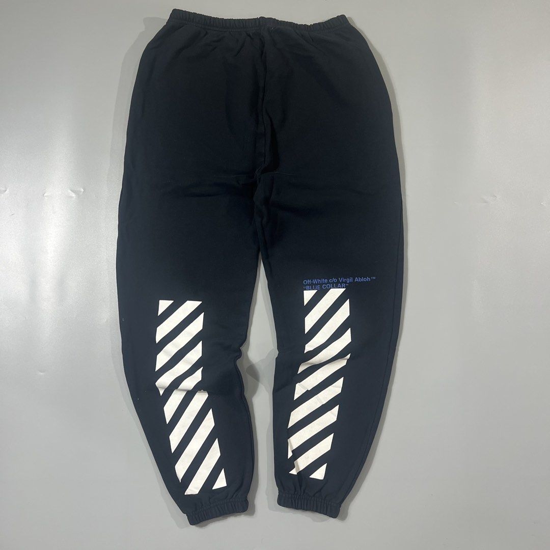 OFF-WHITE c/o Virgil Abloh "BLUE COLLAR" Diagonal Stripe Sweatpants (Category: Joggers) located in Baguio. Submitted by pinkpixie (Listing ID 1454153389, Image 1). Description: Authentic - Iconic diagonal stripes on legs - "BLUE COLLAR" text detail on left leg - Elastic waistband with drawstring - Ribbed cuffs - Comfortable fit.