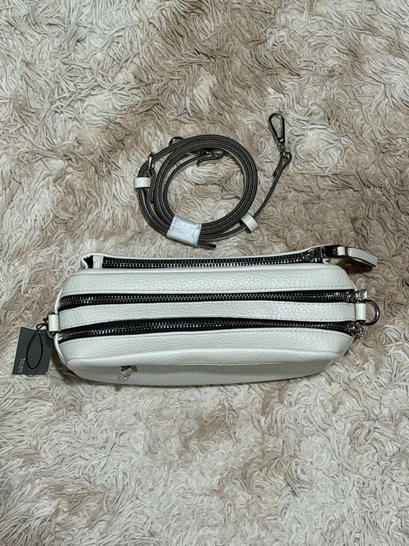 Parfois Rancho2 Crossbody Bag (Category: Cross-body Bags) located in Paranaque City. Submitted by apcastillo (Listing ID 1454084609, Image 3). Description: Brand: Parfois Dimensions: 25 × 9.5 × 17 cm (L × W × H) Strap Drop: Adjustable, up to 55 cm Color: Off White Condition: 10/10 (Brand New, Never Used) 📦 Inclusions: Bag, plastic and Parfois paper bag ✨ 100% Guaranteed Authentic Features: - Premium pebbled faux leather exterior (100% Polyuretha