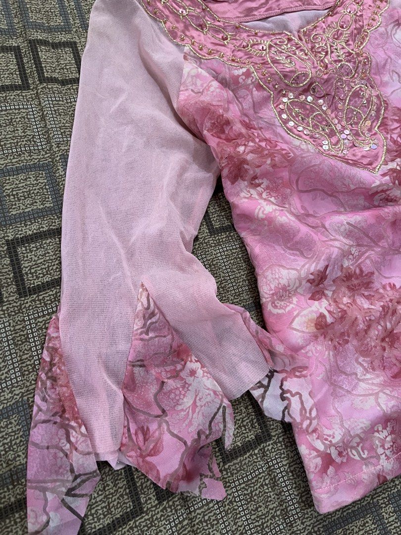 Pink Floral Beaded Bell Sleeve Top (Category: Blouses) located in Davao. Submitted by rel18 (Listing ID 1454045280, Image 2). Description: - Pretty pink top with a charming floral print. - Features delicate sheer bell sleeves. - Intricate beadwork and sequins adorn the neckline. - Ideal for parties or a stylish night out. - A truly unique and eye-catching design..