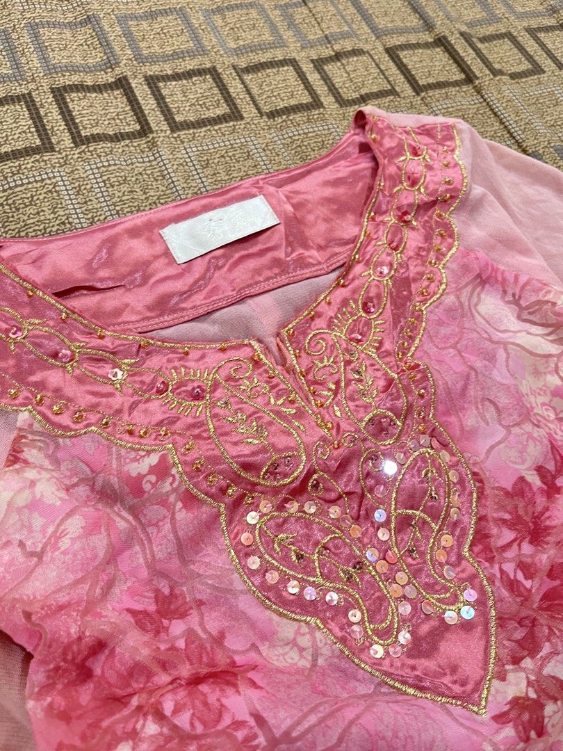 Pink Floral Beaded Bell Sleeve Top (Category: Blouses) located in Davao. Submitted by rel18 (Listing ID 1454045280, Image 3). Description: - Pretty pink top with a charming floral print. - Features delicate sheer bell sleeves. - Intricate beadwork and sequins adorn the neckline. - Ideal for parties or a stylish night out. - A truly unique and eye-catching design..